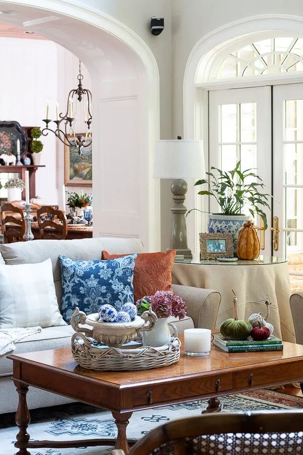 a living room filled with lots of furniture and decor