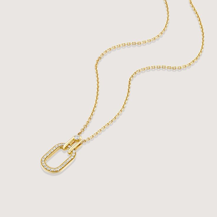 A gold chain and pendant, inspired by the interlinking of cufflinks, brings this necklace to life. As part of our Tailored Collection we studied all elements of suiting, and were fascinated by how a cufflink weaves itself through a button hole and connects to offer a practical yet beautiful finish. The oval pendant with diamond tracing hangs onto the chain with a hook that has a diamond at its center. The frame of the pendant measures 17mm and has 25 diamonds set within. If ordered in rose gold, the chain will be our Rollo chain. All features can be customized! Please contact us if you wish to make changes, we love making custom designs. All of our jewelry is carefully handmade in our atelier. *HC diamond are all conflict-free diamonds To order by phone 972-72-2991000 Gold Chain And Pendant, Chain And Pendant, Gold Chain With Pendant, Button Hole, A Hook, Oval Pendant, White Diamonds, Conflict Free Diamonds, White Diamond