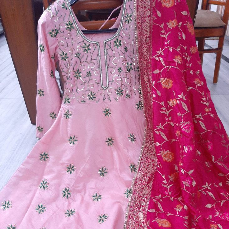 Item Overview ATHARVA Hand Embroidered Anarkali Dress/Pink/Majenta/All Over Embroidery/Banarsi Meenakari Dupatta/Maxi/A-Line/Customized Stitching/Wedding/ AK 5002 Fabric: * Shirt: Chanderi Silk/2.5 Mts, with Beautiful All Over Hand Embroidery * Dupatta: Banarsi Silk Meenakari Dupatta 2.5Mts/ (Motifs may wary) * Salwar: Santoon Silk 2.5 Mts. Excusive Hand Embroidered Party Wear Punjabi Suit. Customization: * Fabrics: Designs Can be made in different Fabrics. * Stitching Available Care: * Dry Clea Multicolor Embroidered Anarkali Set For Wedding, Pink Raw Silk Sharara For Festivals, Semi-stitched Floor-length Anarkali Set For Traditional Ceremonies, Pink Chanderi Dress With Intricate Embroidery, Pink Raw Silk Sharara With Zari Work, Pink Anarkali Set With Intricate Embroidery In Art Silk, Pink Resham Embroidery Sharara In Dola Silk, Pink Dola Silk Sharara With Resham Embroidery, Pink Raw Silk Sharara For Navratri