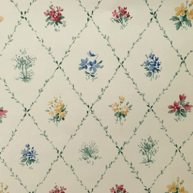 an old wallpaper with flowers and vines on it