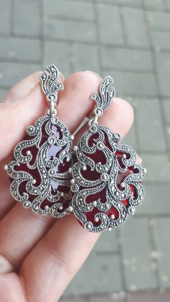 Huge red silver ring Marcasite Large Red Ring Big Ruby silver Ring Vintage red jewelry Silver statement red jewelry Armenian Marcasite RingWe make the ring in any size. Tell us the US Ring Size you want when ordering a ringMore photos of the green jewelry set check out herehttps://www.etsy.com/listing/682038255/huge-green-earrings-marcasite-large-ring?ref=shop_home_active_72&frs=1RINGWeight 12 gramsEARRINGS Weight of earrings 14 gramsLength of earrings 5cm= 2inch Nickel-free Red Jewelry For Anniversary, Ornate Red Sterling Silver Earrings, Handmade Red Jewelry For Anniversary, Red Sterling Silver Ring, Red Sterling Silver Filigree Earrings, Nickel-free Red Jewelry For Wedding, Nickel Free Red Jewelry For Wedding, Red Filigree Jewelry For Formal Occasions, Ornate Red Jewelry As Gift