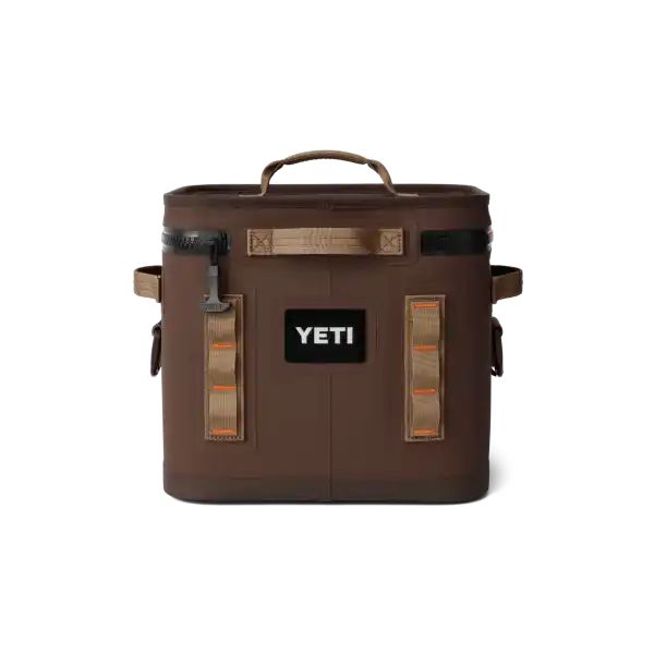 the yeti cooler is brown and has two handles