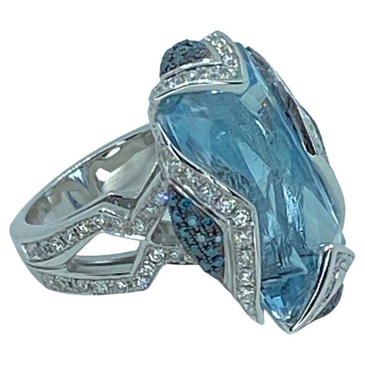 Luxury Platinum Topaz Gemstone Ring, Luxury Topaz Ring With Diamond Accents, Luxury Blue Topaz Ring In Platinum, Luxury White Gold Topaz Ring, Luxury Platinum Topaz Ring With Accent Stones, Luxury Multi-stone White Gold Topaz Ring, Luxury White Gold Multi-stone Topaz Ring, Luxury White Gold Topaz Ring With Multi-stone, Luxury White Gold Ring With Aquamarine