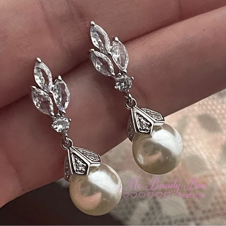 Crystal Pearl Drop Earrings Light Weight Dainty Cute Wedding Earrings. You Wont Even Notice You Have These On. A Classic Simple Take For An Elegant Look. Gold Plated Silver Earrings With Cz Crystals That Sparkle So Beautifully With A Stimulated Pearl. New To Poshmark? Sign Up Now With My Code: Mobeautybae To Save $10 On Your First Order. Relatable Searches: Wedding Earrings, Drop Earrings, Crystal Earrings, Silver Earrings, Pearl Earrings, Statement Earrings, Light Weight Wedding Earrings, Short Antique Pearl Earrings, Delicate Wedding Earrings, Earrings Aesthetic Silver, Bridal Jewelry Pearl, Vintage Pearl Earrings, Elegant Wedding Jewelry, Pearl Wedding Earrings, Dressy Earrings, Crystal Pearl Earrings