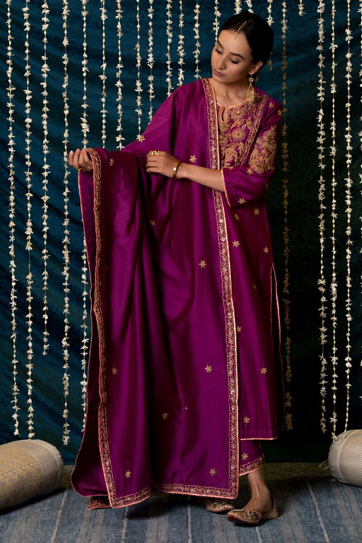 Purple kurta, enhanced with handcrafted zardozi, sitara and zardozi jaal work on the neck, buttas on the sleeves and handcrafted buttis all over. Paired with farshi pant made in a soft modal cotton fabric detailed with butti work at the hem. Coms with a dupatta.
Component: 3
Pattern: Hand Embroidery
Type Of Work: Zardozi,Sitara
Neckline: Notched Neck
Sleeve Type: Three Quarter Sleeves
Fabric: Kurta: Chanderi Silk, Pant: Soft Modal Cotton, Dupatta: Chanderi Silk
Color: Purple
Other Details: 
Side Embroidery Zardozi, Silk Pant, Cotton Dupatta, Indian Ethnic Wear, Cotton Pants, Set For Women, Three Quarter Sleeves, Aza Fashion, Sleeve Type