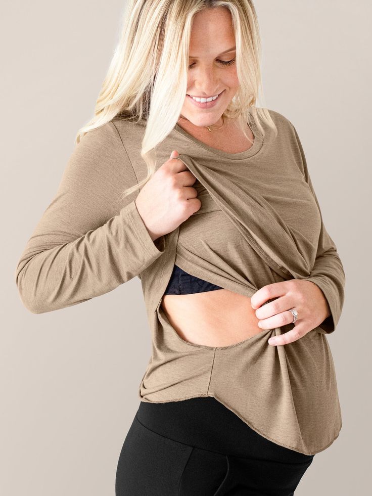 Super-soft and modern with a flattering scoop neck, the Essential Nursing & Maternity Long Sleeve T-shirt will be your go-to for all-day (and all-night!) comfort. A hidden underlayer allows for easy, discreet breastfeeding -- plus the two-layer construction creates a great drape, easy fit, and extra coverage. The long sleeves make it perfect for cooler weather, but the breathable bamboo fabric means it’ll work in warmer weather too, and it looks great with pajama pants, shorts, and everything in between. An essential long-sleeve tee for pregnancy, nursing, and comfort for years to come! Nursing And Pumping, Nursing Sports Bra, Delivery Gown, Nursing Maternity, Nursing Tank, Nursing Accessories, Swimming Outfit, Maternity Nursing, Cooler Weather