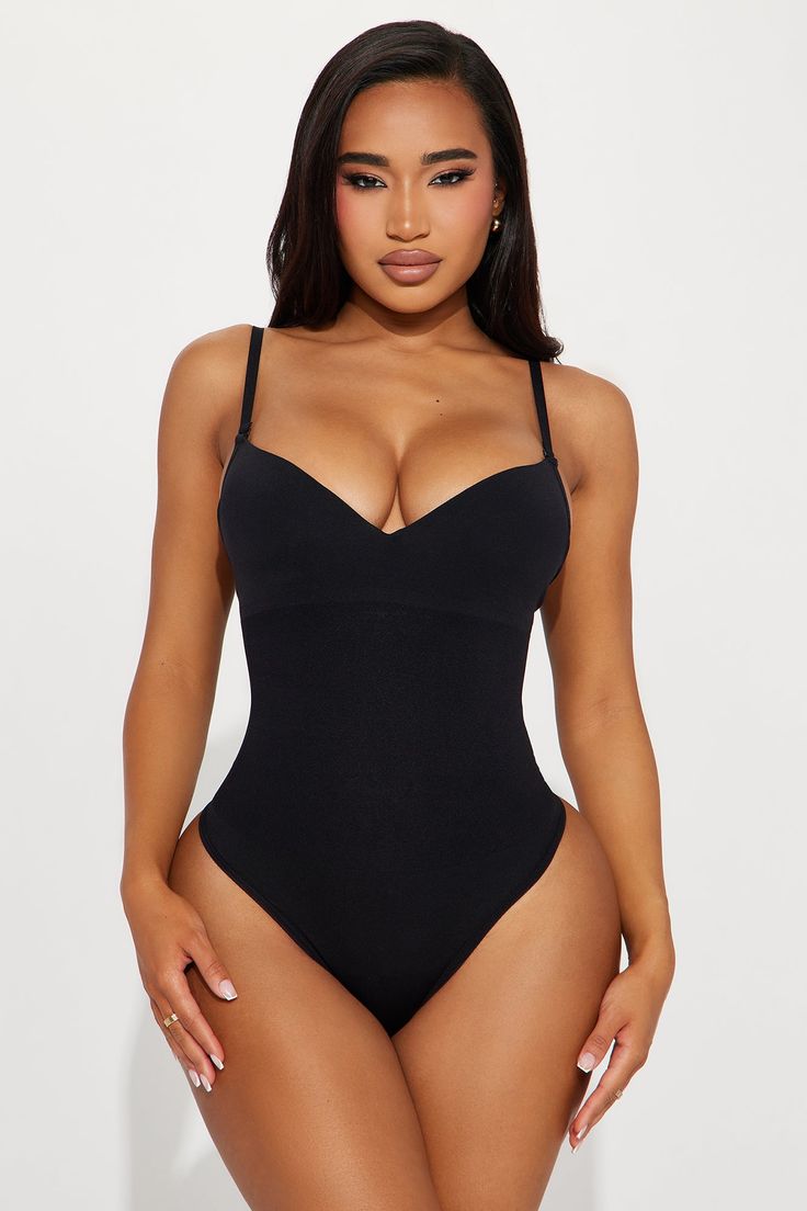 Available In Black And Nude. Super Strong Support - Powerful sculpting for maximum definition Shapewear Bodysuit Adjustable Straps Padded Wireless Bra Cups Waist Compression Panel Thong Bottom Hook And Eye Closure Stretch Final Sale Self: 88% Nylon 12% Elastane Imported | Hourglass Figure Compression Shapewear Bodysuit in Black size Medium by Fashion Nova Thong Shapewear, Compression Shapewear, Shapewear Bodysuit, Wireless Bra, Lingerie Romper, Lingerie Sleepwear, Matching Dresses, Black Bodysuit, Bra Cups