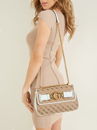 Finish your look on a chic note when you carry this faux-leather crossbody designed in a compact silhouette featuring belted logo hardware and a convertible chain strap ideal for an easy transition to shoulder wear. Convertible strap with 12.5-23" drop 8.5"L x 7"H x 3.25"D Chic Spring Bags With Logo, Chic Crossbody Shoulder Bag With Logo, Chic Workwear Bags With Logo, Chic Crossbody Shoulder Bag With Metal Logo, Chic Crossbody Bag With Metal Logo, Chic Shoulder Bag With Metal Logo, Convertible Crossbody Bag, Look On, Lifestyle Brand