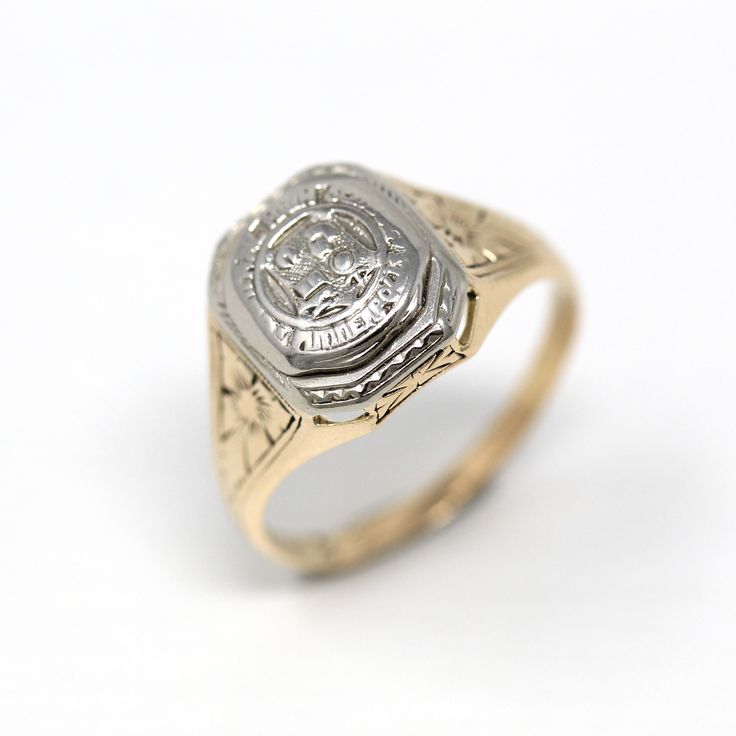 Lovely antique dated 1927 Art Deco era 14k yellow and white gold signet ring! This stylish statement ring is is adorned with floral designs on each shoulder. The ring face reads Minneapolis High School with a school emblem on the front. The inside of the ring band is sweetly engraved 'L.E.J. - 27.' A fantastic piece of fine Art Deco era dated jewelry! *Sale - price reduced from $425 USD to $395 USD.  ERA - Dated 1927 - Art Deco  METAL / MATERIAL - 14k yellow & white gold MARKINGS / HISTORY - Ins Classic Hallmarked Signet Ring Collectible, Classic Hallmarked Signet Ring For Collectors, Collectible 14k Gold Diamond Ring, Victorian Yellow Gold Engraved Ring With Polished Finish, 14k Gold Art Deco Jewelry, Victorian 14k Gold Signet Ring With Polished Finish, Victorian 14k Gold Diamond Cut Rings, Vintage Yellow Gold Diamond Ring For Formal Occasions, 14k Gold Hallmarked Signet Ring With Round Cut