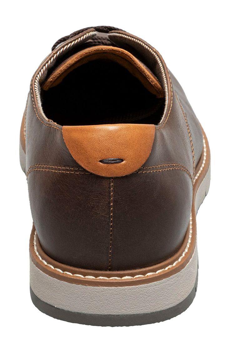 A plain toe and streamlined silhouette lend timeless sophistication to a rich leather derby grounded by a cushioned footbed and flexible rubber sole. Lace-up style Cushioned footbed Leather upper/textile lining/rubber sole Imported Slip-on Oxfords For Derby, Brown Business Oxfords With Removable Insole, Business Brown Oxfords With Removable Insole, Derby Slip-on Oxfords With Textured Sole, Derby-style Slip-on Oxfords With Textured Sole, Slip-on Oxfords With Leather Footbed For Derby, Slip-on Oxfords With Textured Sole For Derby, Leather Footbed Slip-on Oxfords For Derby, Oxford Moc Toe Shoes With Leather Footbed