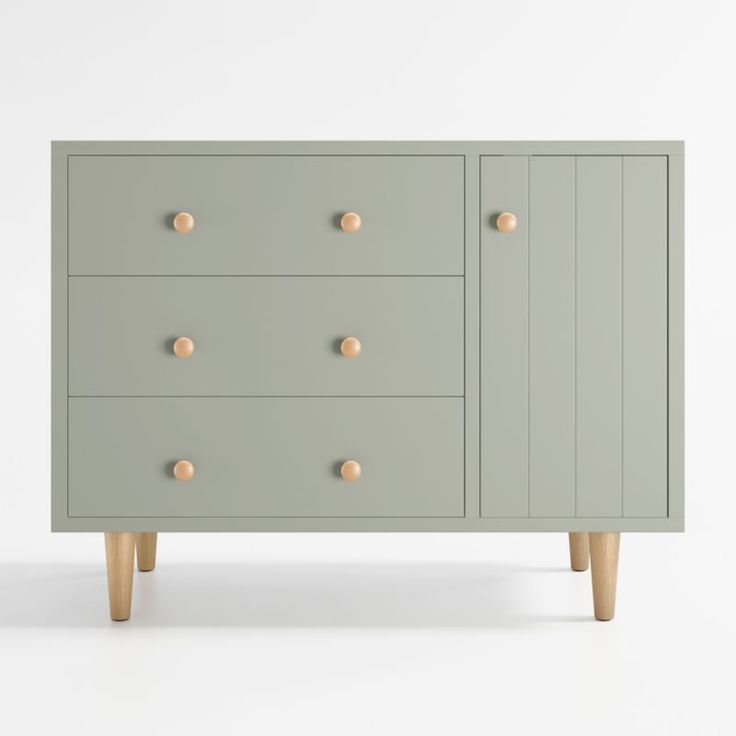 a grey dresser with wooden legs and knobs on the top, against a white background