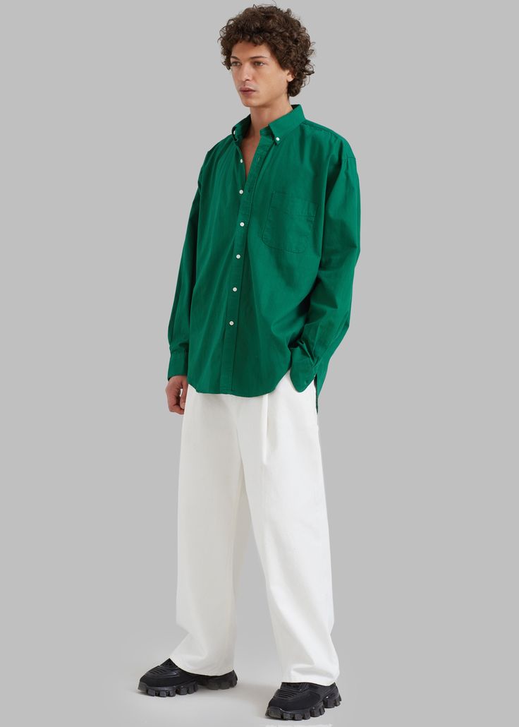 Color: GreenMidweight woven cotton fabric Oversized fitPointed collar Single chest pocketButton cuffsSlight high low hemCurved hemContrast front button closureUnlined100% CottonGentle Machine Wash or Dry CleanImportedOne Size Green Shirt With Button Cuffs For Daywear, Green Relaxed Fit Shirt With Button Cuffs, Green Shirt With Button Cuffs And Relaxed Fit, Green Cotton Shirt With Shirttail Hem, Green Cotton Shirt With Button Cuffs, Green Shirt With Placket For Daywear, Oversized Green Classic Top, Classic Oversized Green Top, Classic Green Oversized Top