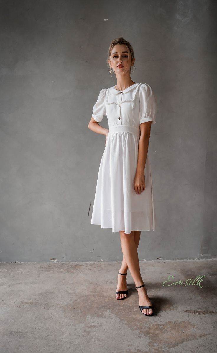 "This design linen dress is perfect for summer and fall! 100 % designed and handmade by Emsilk. I am pleased to offer your garments made to measure at no extra cost. * Detail: - Collared neckline - Coconut buttons on the front - Small gathered decoration on the front - Fit and flare bottom - Fully lined - Invisible zipper on the back - Below the knee length - High quality linen, washed linen, soft linen - The model is 5'6\" tall and wearing size S. * Care: - Dry clean or machine washed with cold Modest Fitted Puff Sleeve Summer Dress, Cottagecore Fitted Linen Dress For Summer, Modest Fitted Puff Sleeve Dress With Short Sleeves, Elegant Vintage Short Sleeve Summer Dress, A-line Short Sleeve Dress For Summer Daywear, Puff Sleeve Vintage Dress For Summer, Fitted Short Sleeve Linen Dress For Work, Cottagecore Summer Puff Sleeve Dress With Gathered Sleeves, Cottagecore Puff Sleeve Dress With Gathered Sleeves For Summer