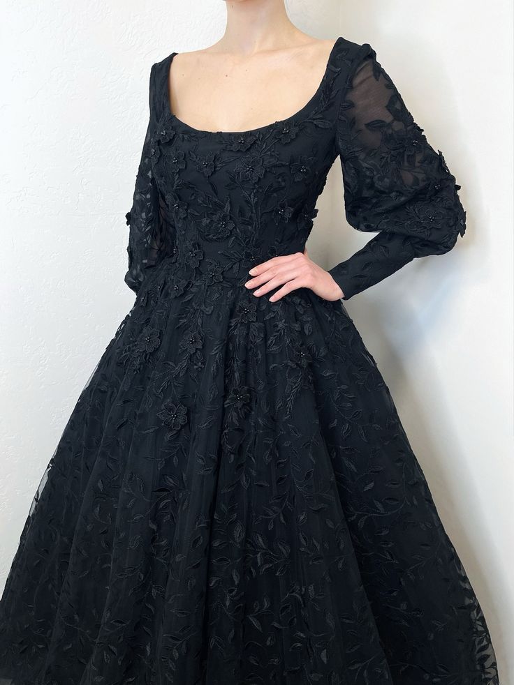 If your wedding is in 1-4 months, please choose express shipping! Made to order! Black lace wedding dress. The skrit is made of many layers of black soft tulle for poofiness and the top layer is leaf design lace/tulle. Bodice and sleeves decorated with 3D floral appliques. Sleeve cuffs decorated with matching black buttons.  Open back, the skirt has hidden zipper closure. More info available on official website : sherbonclothing.com After you place the order, I will contact you and send the list Black Ball Gown Evening Dress With Lace Bodice, Black Lace Bodice Ball Gown For Wedding, Black Lace Bodice Dress For Debutante Ball, Black Tulle Ball Gown With Tulle Skirt, Black Lace Ball Gown For Party, Fitted Black Gown With Tulle Skirt, Black Fitted Gown With Tulle Skirt, Black Evening Dress With Lace Bodice For Wedding, Black Tulle Skirt Ball Gown For Wedding