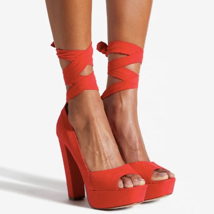 A Block-Heeled Pump With Wraparound Ankle Ties. Material: Faux-Leather Features: Sd Dream Sole - Double The Padding For Comfort, Support, And Ease Of Movement Platform Height: 1.25" Outside Heel Height: 5.5" Closure: Ankle Ties Shaft Height: 3.5" Color: High Risk Red Summer Lace-up Heels With Red Sole, Summer Block Heel Shoes With Red Sole, Summer Block Heel With Red Sole, Summer Block Heels With Red Sole, Red Lace-up Party Sandals, Trendy Ankle Tie Heels With Wrapped Heel, Spring Night Out Heels With Red Sole, Chic Red Heels For Summer, Chic Red Summer Heels