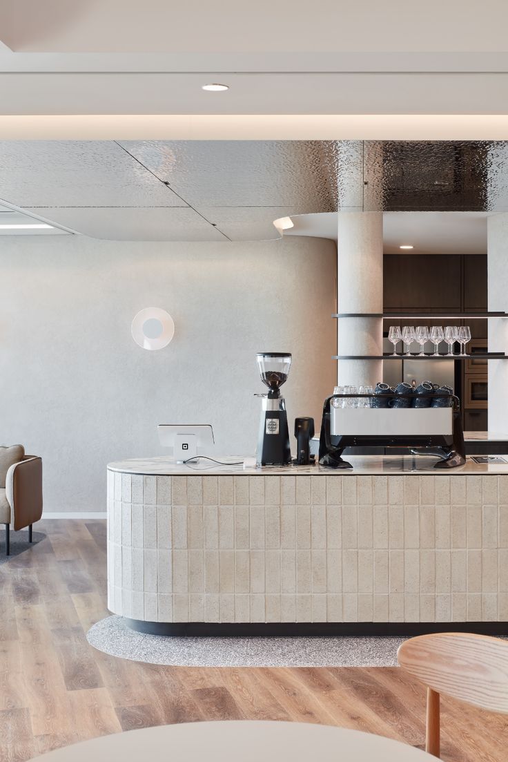 an open kitchen and dining area in a modern building