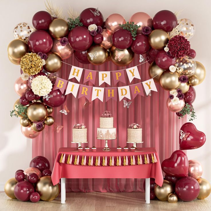 a birthday party with red and gold balloons, cake and desserts on the table