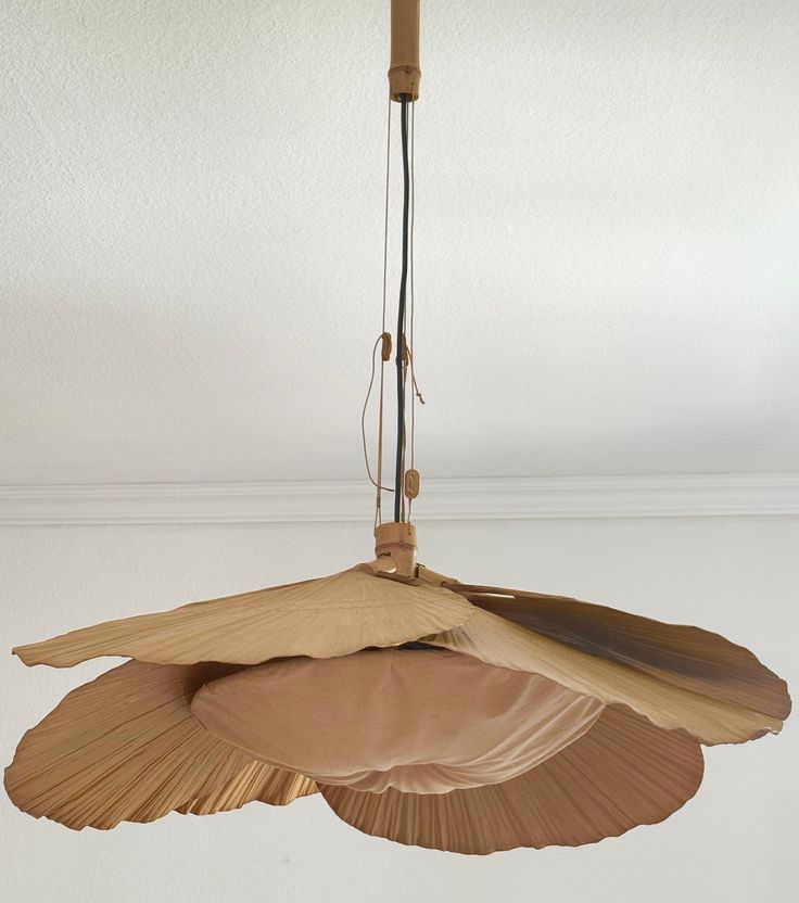 an umbrella hanging from the ceiling in a room