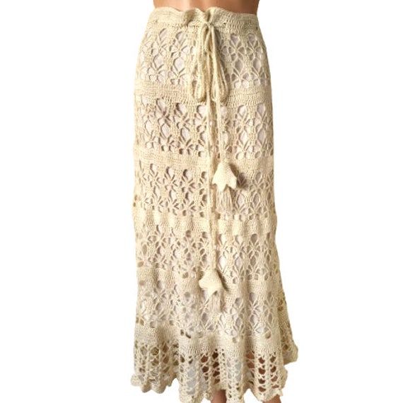 True vintage 1970s homemade crocheted rich lace women's skirt in off white color. Material - it looks like cotton blend. Tie waist fastening. Full lined with flannel cotton fabric. Suitable size L and XL. Measurements /flat/ - max waist 18.5''/47cm / need to duplicate//adjustable/ hip 20''/51cm / need to duplicate/ length 35''/89cm Very good condition. Please note that it should be carefully hand washed only, to dry in a horizontal position to avoid stretching. Bohemian Lace Maxi Skirt For Beach, Bohemian Cream Maxi Skirt For Beach, Bohemian Cream Crochet Dress With Crochet Trim, Beige Bohemian Crochet Lace Dress, Bohemian Lace Skirt With Crochet Trim, Bohemian Cream Crochet Lace Dress, Beige Crochet Skirt For Summer, Bohemian Crochet Lace Skirt, Crochet Skirt Vintage