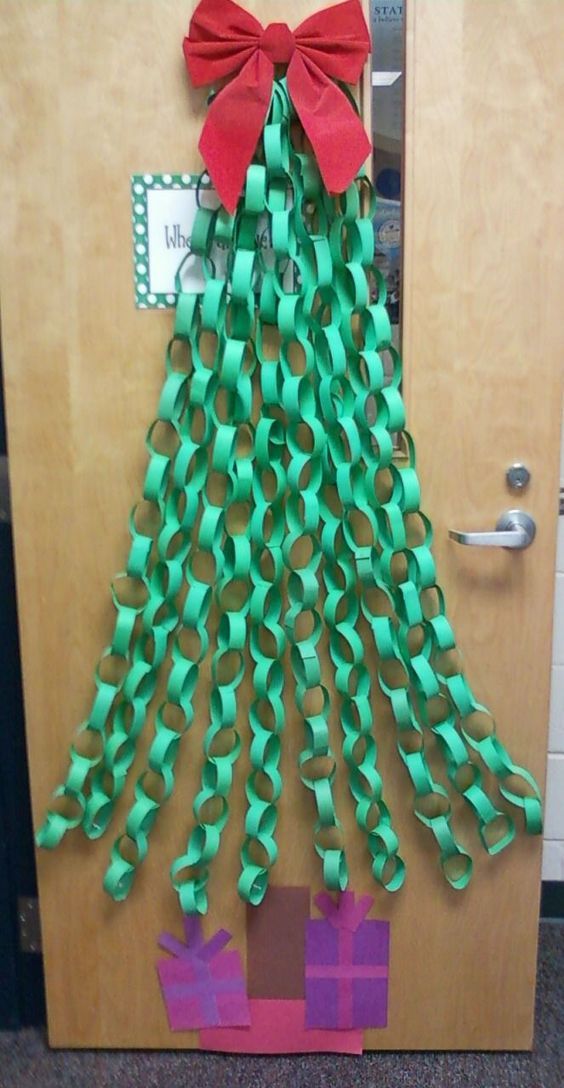 a christmas tree made out of green ribbon