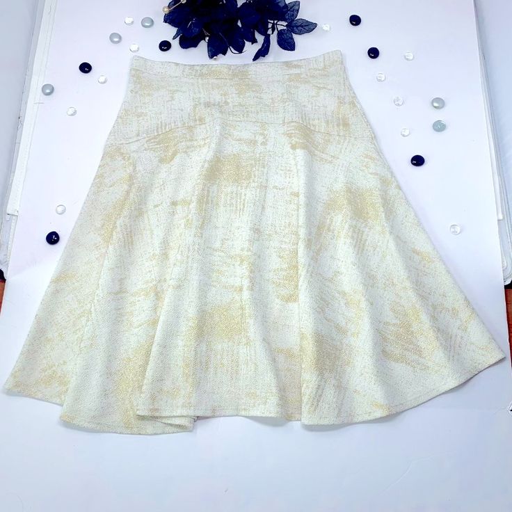 This Super-Soft, Flared Mini Skirt Features A High-Waisted, Skater Skirt Design, With A White And Gold Foil Holiday Print That Is Perfect For Day To Night And Dressing Up Any Outfit. Unlined, With Some Stretch. Style Many Ways. Exellent Condition, New And Never Worn. Fits Adults, One Size. Shown On Usa Size 8 Dress Form. Hand-Wash, Air-Dry Recommended. Sustainable Shipping, Plus Gift-Wrapping Available By Request. Ready To Ship. Features: - Super Soft, Flared Style. - High-Waisted, Light Stretch Fitted A-line Maxi Skirt With Gathered Detail, Stretch A-line Skirt With Lining, Fitted A-line Pleated Mini Skirt, Chic Stretch A-line Skirt, Stretch A-line Maxi Skirt For Summer, Summer Stretch A-line Maxi Skirt, Spring Stretch A-line Maxi Skirt, Fitted A-line Maxi Skirt With Lining, Summer Fit And Flare A-line Skirt