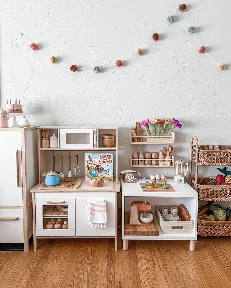 a wooden play kitchen with lots of toys