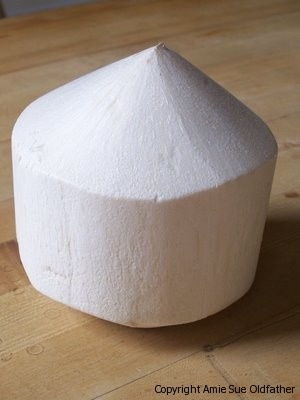 a white object sitting on top of a wooden table