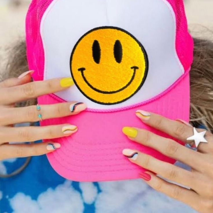 Snap On Closure Hand Wash Only Sun Protection: This Smiley Face Cap Is Perfect For All Seasons. Trendy Hats Keep Your Head Cool In The Summer And Warm During Winter, As Well A Protecting You From Sunburns When It's Hot Outside. Our Smiley Hat Will Protect Your Eyes From The Sun, And Shield Your Face From Harmful Uv Rays. It’s Perfect For A Day Out In The Town. The Trucker Cap Is Extremely Lightweight And Breathable. You'll Forget You're Wearing It! Fit Everyone: Cute Trucker Hats Are Comfortable And Secure To Wear! This Mesh Trucker Hat Has An Adjustable Plastic Snap Closure At The Back For You To Change The Size When You Wearing It. The Perfect Fit Ensures That This Smile Trucker Hat Is Funky Pink Hat For The Beach, Funky Pink Hats For The Beach, Trendy Embroidered Trucker Hat, Trendy Embroidered Trucker Hat For Summer, Fun Spring Trucker Hat, Cute Pink Embroidered Hat, Fun Pink Trucker Hat, Trendy Yellow Trucker Hat For Spring, Pink Spring Beach Trucker Hat