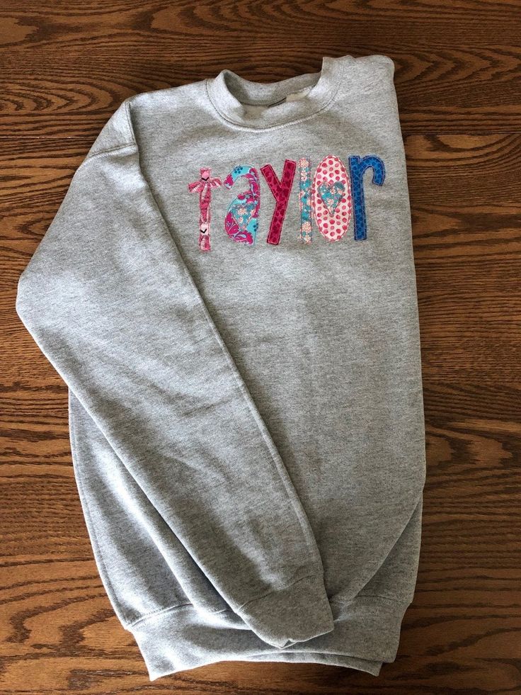 This sweatshirt is even better in person! So CUTE! Perfect for a birthday gift or just because. This listing is for YOUTH sizes. Name will be appliqued front center of sweatshirt I use Gildan Brand Crew Neck (Youth Sizes S - XL). S = 6-8, M = 10-12, L = 14-16, XL = 18-20 NOTE: These are YOUTH sizes! I have tons of color options. The best way would be to order a sweatshirt, let me know what fabric colors you want for the name and I will send you options. This is a custom made sweatshirt and there School Crew Neck Sweatshirt With Name Print, Cotton Sweatshirt With Name Print, Cotton Sweatshirt For Birthday In Winter, Cotton Sweatshirt For Winter Birthday, Cotton Long Sleeve Sweatshirt With Name Print, Fall Birthday Cotton Sweatshirt, Casual Cotton Sweatshirt For Birthday, Personalized Cotton Crew Neck Sweatshirt, Personalized Cotton Sweatshirt For Winter