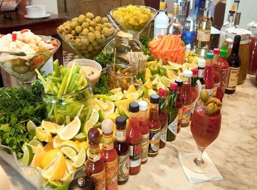 a table filled with lots of different types of food and drinks on it's sides