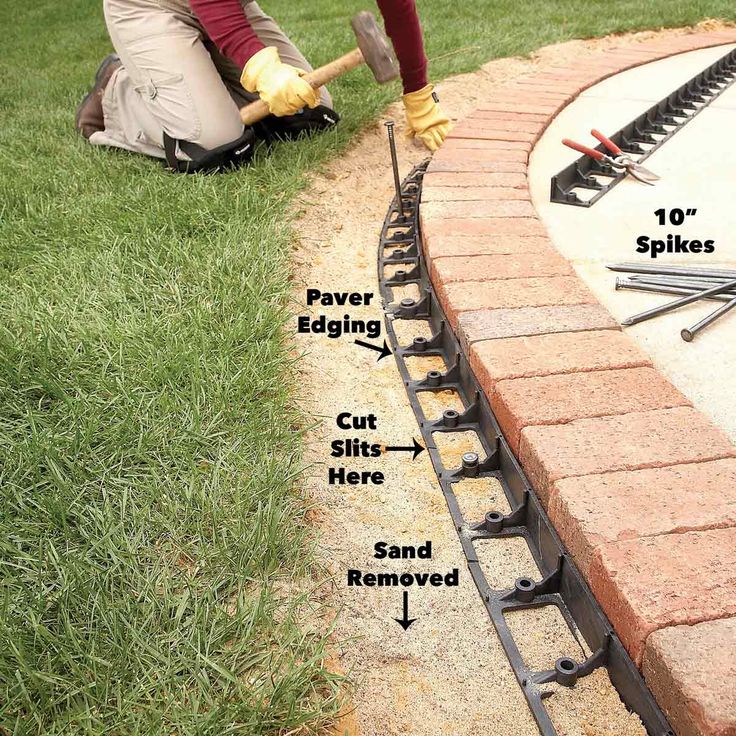 a man laying bricks on the ground with tools in his hand and instructions to install them