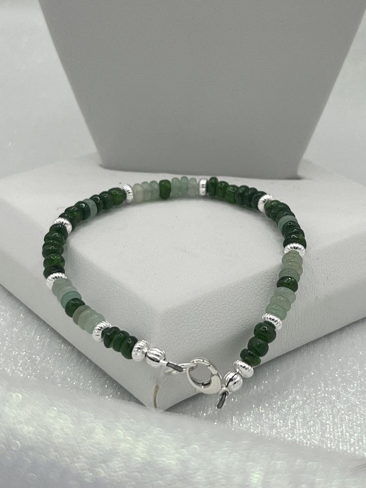 Green gemstones necklace and bracelet set. Finished with silver findings. Silver Faceted Round Beads Gemstones, Silver Jade Beaded Bracelets With Gemstone Beads, Silver Jade Beaded Bracelets With Gemstones, Silver Jade Beaded Bracelets With Natural Stones, Silver Jade Beaded Bracelet With Natural Stones, Silver Jade Bracelet With Natural Stones, Silver Aventurine Bracelet Jewelry, Silver Aventurine Bracelet, Green Gemstone Necklace