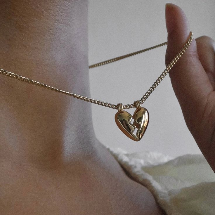 Heartbreak never looked so good - embrace all that love entails (including the messy) with the Mod + Jo Taryn Broken Heart Necklace. Delicately strung on a classic curb chain, this is not your average heart necklace. Gold plate over brass 16-18" in length Nickel, brass, and lead-free Friendship Necklace With Heart Pendant And Charm, Friendship Necklace With Heart Pendant, Heart-shaped Adjustable Chain Necklace For Friendship, Heart-shaped Friendship Necklaces With Adjustable Chain, Heart-shaped Friendship Necklace With Adjustable Chain, Friendship Heart Necklace With Adjustable Chain, Heart-shaped Metal Necklaces For Friendship, Heart-shaped Metal Necklace For Friendship, Dainty Heart Necklace For Friendship