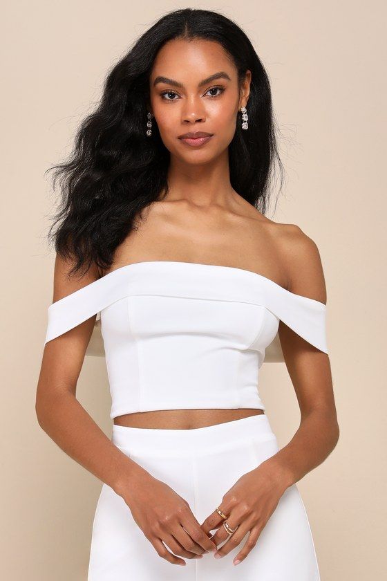 You'll only get more and more fabulous throughout the night while wearing the Lulus Exponentially Chic Ivory Off-the-Shoulder Two-Piece Jumpsuit! Stretchy crepe knit shapes this sensational two-piece jumpsuit that starts with an ultra-cropped top with a princess-seamed bodice and a folded-over, off-the-shoulder neckline (with hidden no-slip strips) that flows into short sleeves. The matching bottoms have a high, banded waist and wide pant legs that finish at full-length hems. An exposed silver z Chic Sleeveless Off-shoulder Top For Party, Fitted Chic Off-shoulder Sleeveless Top, Fitted Chic Sleeveless Off-shoulder Top, Chic Fitted Sleeveless Off-shoulder Top, White Strapless Flirty Top, Chic Sleeveless Off-shoulder Top For Night Out, White Flirty Strapless Top, Flirty White Strapless Top, Elegant Strapless Off-shoulder Top For Summer