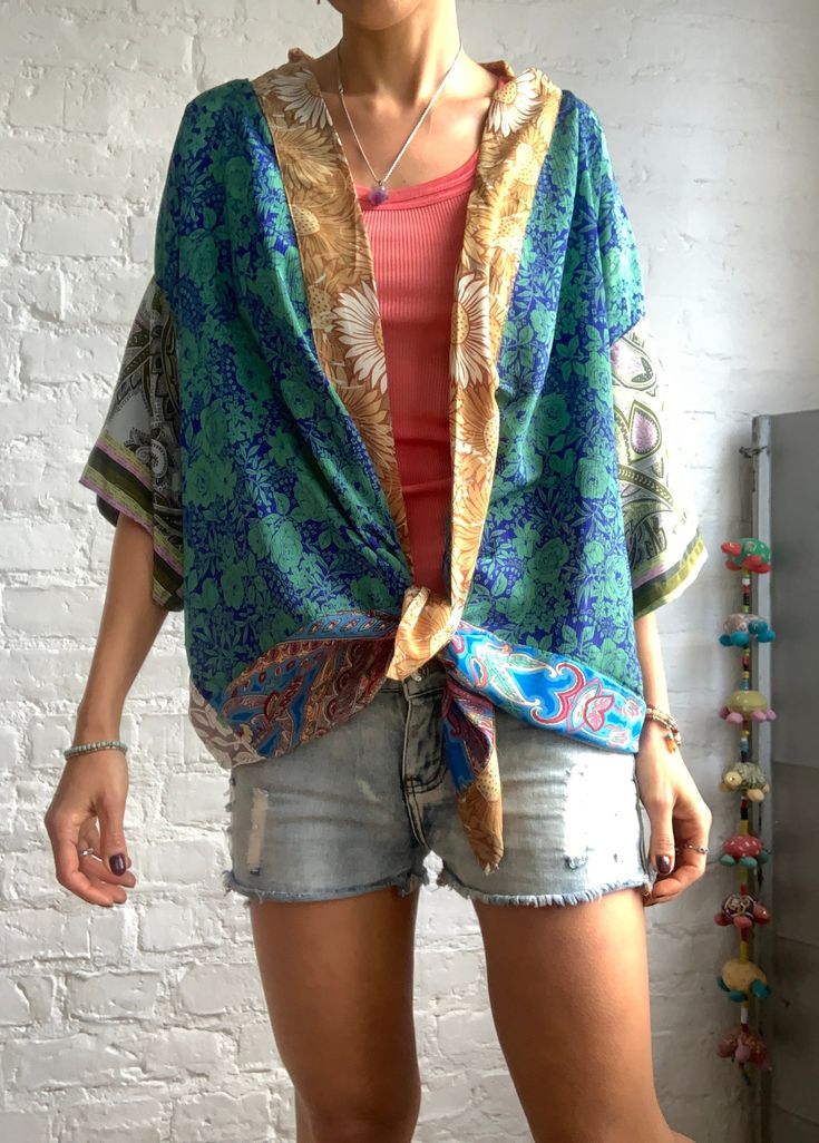 This is colourfull light silk kimono shirt made of different vintage silk materials unisex style, made for both men and woman nice looking with skirt as well as trousers or shorts and can be used all year round as a cover up layered over a long sleeve hippie boho style, great for summer festivals, parties or every day free size more available at https://www.etsy.com/shop/AltheaStores?ref=seller-platform-mcnav Thank you for looking Oversized Multicolor Summer Blouse, Casual Silk Tops With Vibrant Print, Bohemian Rayon Tops With Relaxed Fit, Flowy Hippie Blouse For Vacation, Bohemian Summer Blouse With Relaxed Fit, Oversized Green Bohemian Top, Bohemian Rayon Relaxed Fit Tops, Summer Bohemian Relaxed Fit Blouse, Bohemian Relaxed Fit Rayon Top