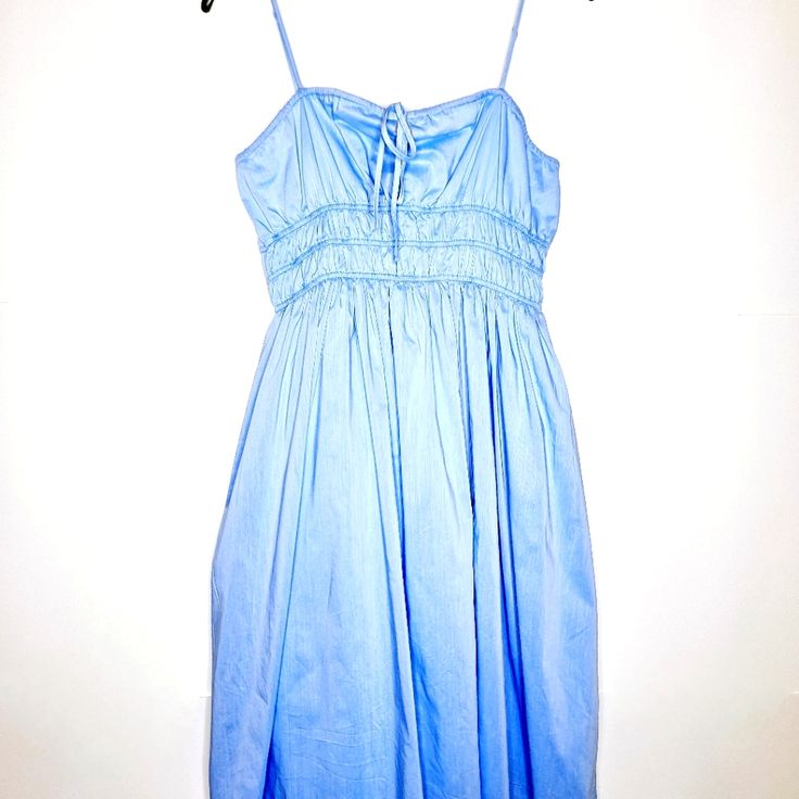 For The Woman That Is Booked And Busy, Brunch, Lunch, The Derby, Or High Tea, This Dress Will Fit All Your Spring And Summer Occasions. It Is Fully Lined, With Adjustable Spaghetti Straps. Made Of Self 65% Cotton And 38% Polyester, Lining 80% Polyester, 20% Cotton. The Measurements Are: Size Large, Pit To Pit 18 Inches, Waist 16 Inches, Length 40 Inches. The Bag And Hat Featured In The Photos Are Available For Purchase In The Closet. This Item Is New With Tags. See Photos For More Details. Light Blue Ruched Beach Dress, Light Blue Ruched Dress For Beach, Cotton Dress With Smocked Bodice And Spaghetti Straps, Light Blue Cotton Midi Sundress, Light Blue Cotton Sundress Midi Dress, Light Blue Knee-length Cotton Dress, Summer Light Blue Cotton Midi Dress, Light Blue Cotton Sundress, Blue Summer Cotton Dress