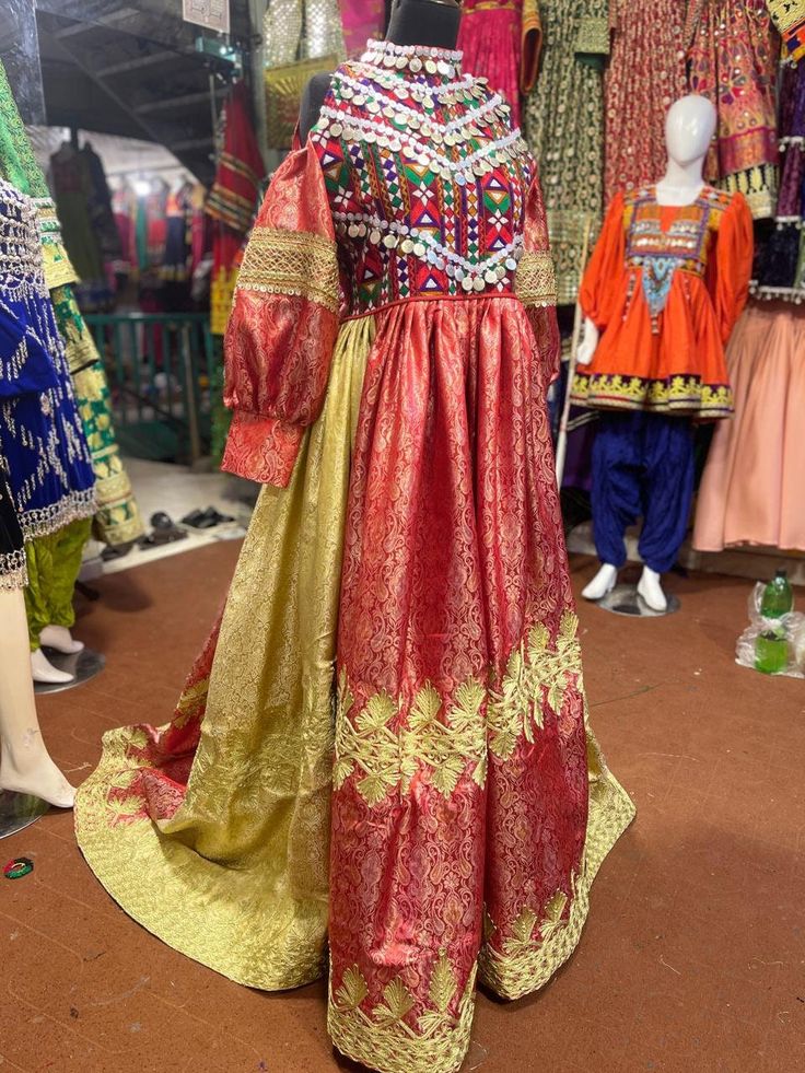 With our exquisitely handmade Charma embroidery on our Afghani Velvet Frock, you can truly step into the world of luxury. This exquisitely crafted dress captures the spirit of Afghani culture and creative dexterity. The sumptuous velvet material falls elegantly, providing both cosiness and an air of grandeur. Our artists have successfully brought to life the exquisite Charma needlework, which adds a layer of cultural luxury and passionately narrates the tales of Afghan customs. Whether it's bein Traditional Long Dress With Traditional Patterns, Festive Maxi Length Dress With Traditional Patterns, Anarkali Dresses With Intricate Embroidery For Traditional Ceremonies, Fitted Embroidered Dress With Traditional Patterns For Eid, Ceremonial Resham Embroidery Dress For Eid, Ceremonial Dresses With Resham Embroidery For Eid, Ceremonial Dresses With Intricate Embroidery For Festivals, Fitted Anarkali Dress With Traditional Embroidery, Traditional Long Festive Dress