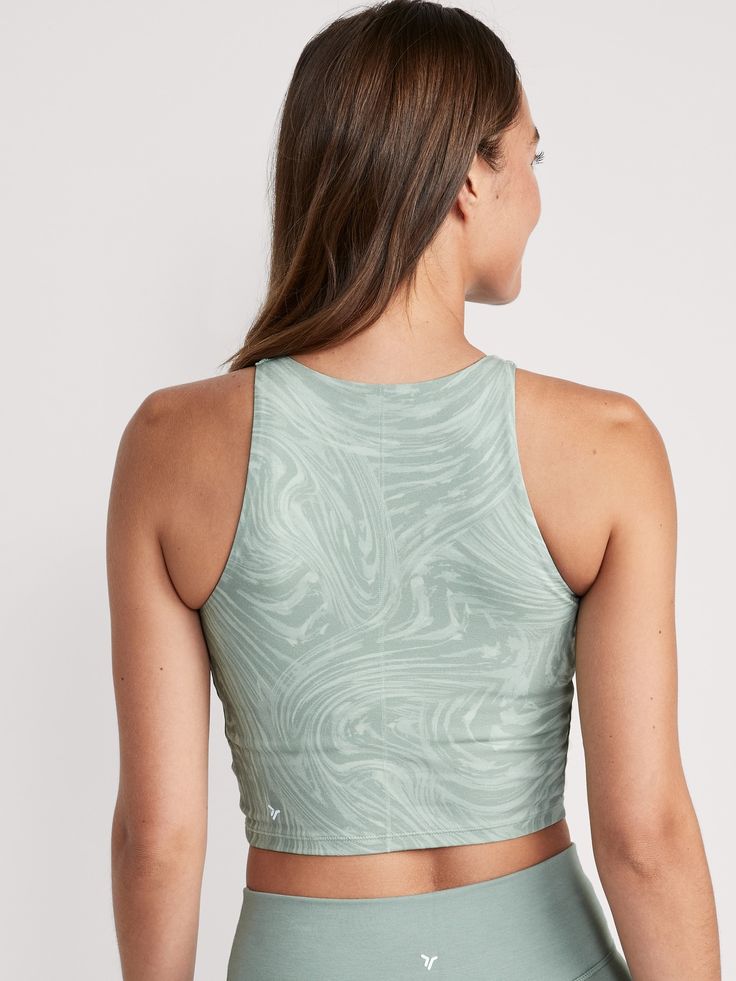 Be poised with every pose in our PowerChill yoga sports bra tank, the perfect balance between om and OMG-softness Crew neck.  Sleeveless arm openings.  Built-in shelf bra, with soft, removable cups for shaping & secure coverage.  Interior front mesh Sports Tops With Built-in Cups And Stretch, Sporty Workout Tops With Built-in Cups, Athleisure Tops With Built-in Cups For Workout, Nylon Training Tops With Built-in Padding, Racerback Tops With Built-in Padding And Medium Support, Racerback Activewear With Built-in Cups For Sports, Nylon Go-dry Racerback Tops, Go-dry Nylon Racerback Tops, Compressive Sports Tops With Built-in Padding