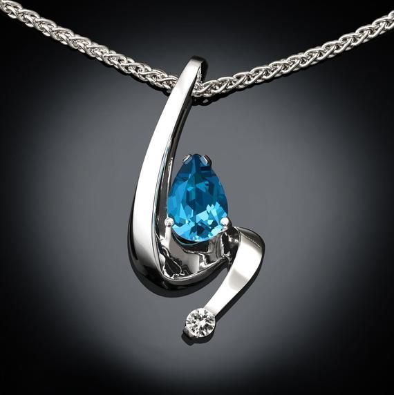 Swiss Blue Topaz and White Sapphire Necklace - Argentium Silver - 3380 - Argentium Chain Included A contemporary, yet timeless design by award winning designer, David Worcester. ( IMPORTANT - PLEASE READ 1. AND 2 BELOW ) 1.) INCLUDED IN THE PRICE IS AN ARGENTIUM SILVER CHAIN APPROPRIATE FOR THE Jewellery Hangers, Swiss Blue Topaz Necklace, White Sapphire Necklace, Alexandrite Necklace, Yucca Valley, Blue Sapphire Pendant, Blue Sapphire Necklace, Fine Gold Jewelry, Blue Topaz Necklace