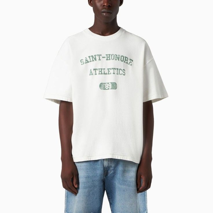 White Cotton T-Shirt By 1989 Studio With Green Lettering Print At Front, Round Collar And Relaxed Fit. Model Wears Size Xl Model Measurements: Height: 188 Cm Chest: 91 Cm Waist: 73 Cm Hips: 95 Cm Size Type: Int Material: Cotton Sku: 2f-Ss24.06co/O_1989-Vw_323 Welcome To The Official Luosophy Poshmark Closet! Luosophy Is A Luxury Brand Reselling Company Founded In San Diego, Ca From 2016. All Our Products Are Imported From Italy And Sold In The Usa. We Do Our Best To Provide High Fashion, Luxury Collegiate Streetwear Tops With Logo Print, Collegiate Crew Neck T-shirt For Streetwear, White Varsity T-shirt For Streetwear, Varsity Style Relaxed Fit Crew Neck T-shirt, Collegiate Crew Neck Tops For Streetwear, White Varsity T-shirt With Screen Print, Varsity Screen Print Tops For Streetwear, Sporty Slogan Tops For Streetwear, Oversized Varsity T-shirt With Letter Print