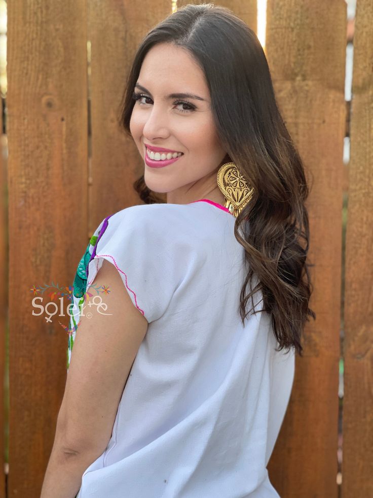 This Beautiful Mexican blouse is full of colorful flowers in both the front and the sleeves that are inspired by Mexican culture. This blouse is embroidered By Mexican Artisans in Chiapas and is completely one of a kind. Purchase the gold plated filigree earrings here: https://www.etsy.com/es/listing/869865239/filigrana-de-corazon-filigrana-clasica?ref=listings_manager_grid Bohemian Peasant Top With Multicolor Embroidered Neckline, Bohemian Peasant Top With Multicolor Embroidery For Beach, Bohemian Tops With Embroidered Sleeves For Vacation, Bohemian Tops With Multicolor Floral Embroidery, Bohemian Peasant Top With Multicolor Embroidery And Floral Print, Multicolor Boho Print Blouse For Festivals, Multicolor Floral Peasant Top For Festivals, Multicolor Short Sleeve Folk Peasant Top, Multicolor Floral Print Festival Blouse