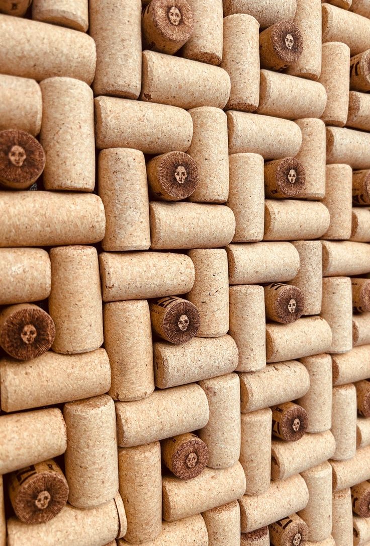 a wall made out of corks with holes in the middle