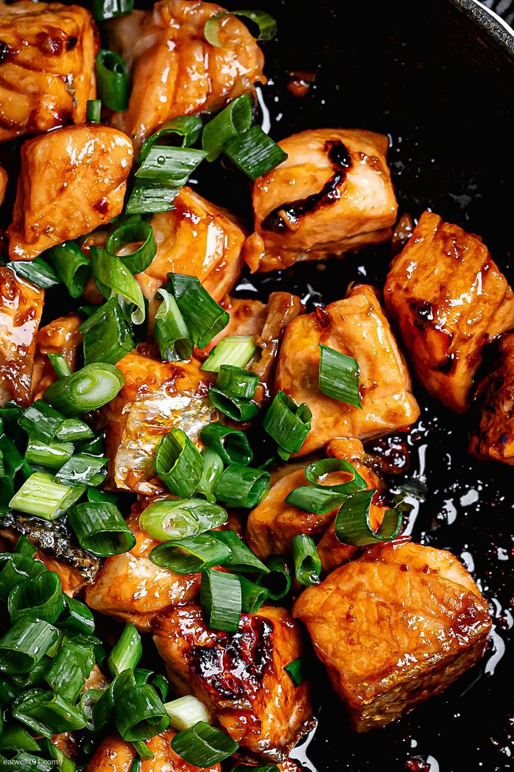 some food is cooking in a pan on top of the stove and it's ready to be eaten