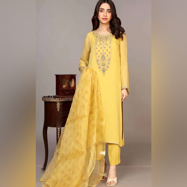 Yellow Chiffon Dress From Boutique. Neck Embroidered, Block Print Duppatta,Plain Pants. Long Shirt, Classic Style. Elegant Yellow Lawn Suit With Dabka Work, Elegant Yellow Lawn Suit For Wedding, Yellow Georgette Unstitched Suit For Eid, Elegant Yellow Unstitched Suit With Dabka, Elegant Yellow Straight Kurta Lawn Suit, Elegant Yellow Lawn Suit With Straight Kurta, Festive Yellow Elegant Lawn Suit, Elegant Yellow Chanderi Lawn Suit, Elegant Yellow Salwar Kameez With Dabka Work