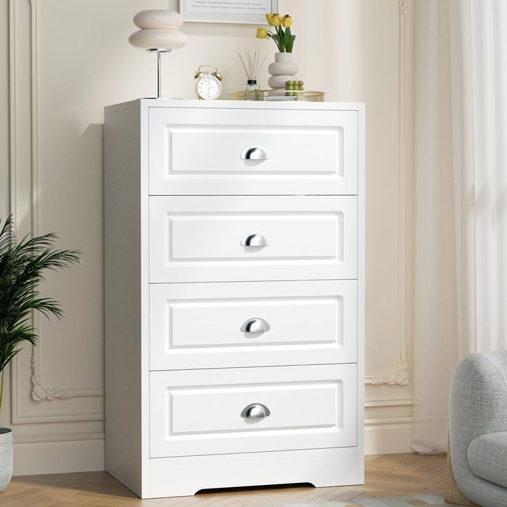 a white chest of drawers in a living room