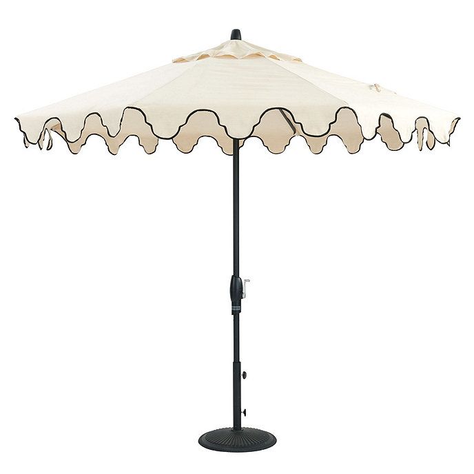 an umbrella that is on top of a stand with the shade off it's sides