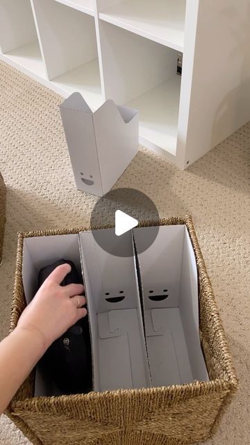 someone is opening the box with their hand and pressing it up to reveal its contents