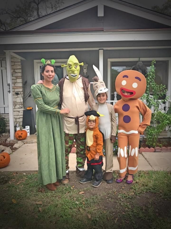 a family dressed up in costumes for halloween