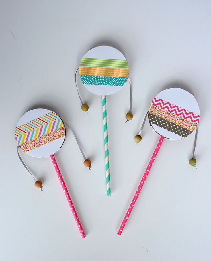 three handmade lollipops with different patterns on them