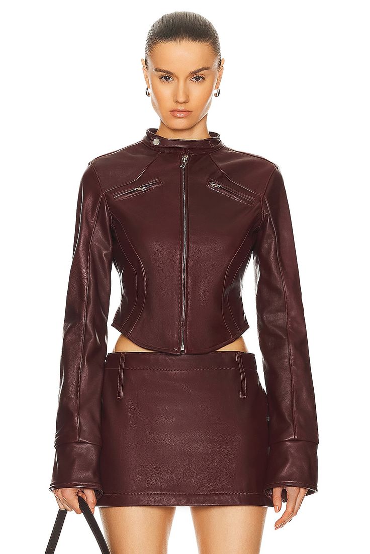 Find Mimchik Leather Moto Jacket on Editorialist. Mimchik Leather Moto Jacket in Burgundy Self: 100% leather Lining: 100% polyester. Made in USA. Professional leather clean only. Front zipper closure. Zipper cuffs. Breast zipper pockets. Leather with asymmetric hem. MMCF-WO3. MC-2009-BRG. About the designer: Luxury Fitted Biker Jacket, Fitted Biker Cropped Jacket With Zipper Closure, Fitted Fall Biker Jacket With Padded Collar, Fitted Biker Jacket With Padded Collar For Fall, Fitted Leather Cropped Jacket With Zipper Closure, Fitted Leather Jacket With Padded Collar, Chic Fitted Leather Jacket, Luxury Fitted Long Sleeve Biker Jacket, Fitted Leather Biker Jacket With Asymmetrical Zip